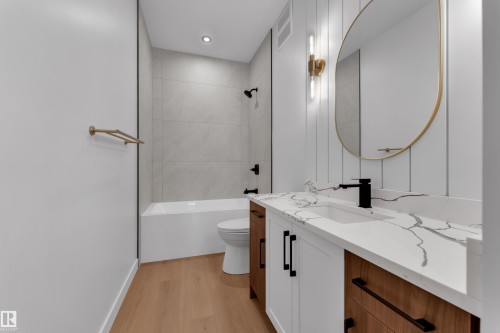 Bathroom featuring vanity, light wood-style floors, shower / bathtub combination, and recessed lighting - 40 Grayson Green, Stony Plain, AB - Indoor Photo Showing Bathroom