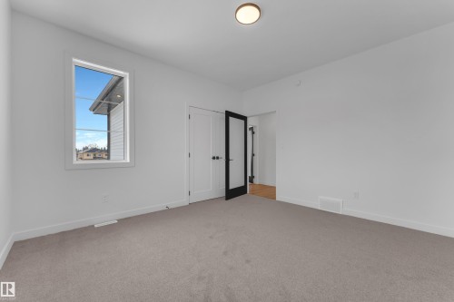 Unfurnished bedroom with light carpet and baseboards - 40 Grayson Green, Stony Plain, AB - Indoor Photo Showing Other Room