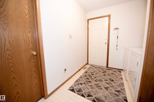 Back Door Leading to Heated Garage, Laundry conveniently located at Garage Entrance. - 12A Invermere Place, St. Albert, AB - Indoor Photo Showing Other Room