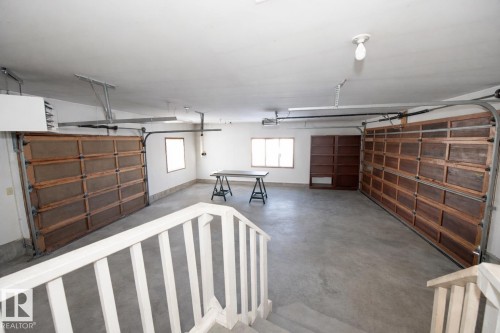 Drive through heated Garage - 12A Invermere Place, St. Albert, AB - Indoor Photo Showing Garage