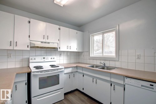 10682 61 Avenue, Edmonton, AB - Indoor Photo Showing Kitchen With Double Sink
