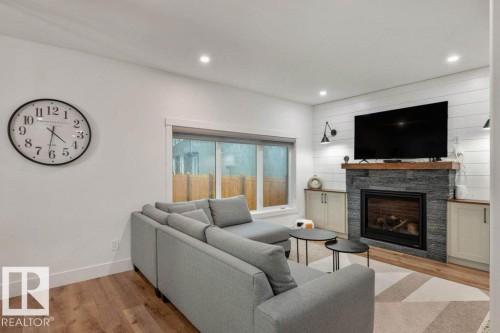 5094 Edgemont Boulevard, Edmonton, AB - Indoor Photo Showing Living Room With Fireplace