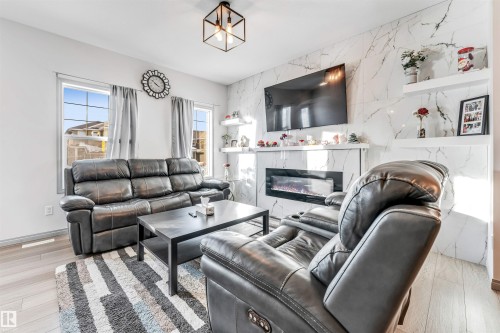 1217 Watt Drive, Edmonton, AB - Indoor Photo Showing Living Room With Fireplace