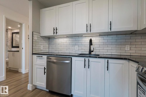 Gorgeous kitchen with stainless steel appliances - 505 10149 Saskatchewan Drive, Edmonton, AB - Indoor Photo Showing Kitchen With Upgraded Kitchen