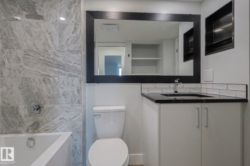 Ensuite Full bathroom with vanity and tub / shower combination - 505 10149 Saskatchewan Drive, Edmonton, AB - Indoor Photo Showing Bathroom