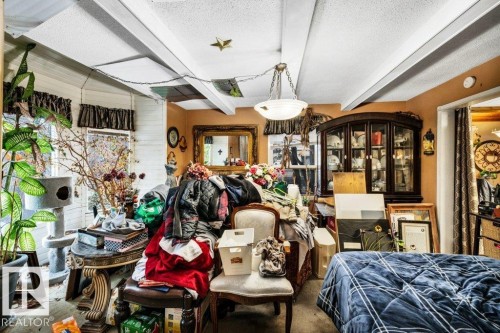 Miscellaneous room featuring a textured ceiling and carpet flooring - 11436 71 Street, Edmonton, AB - Indoor