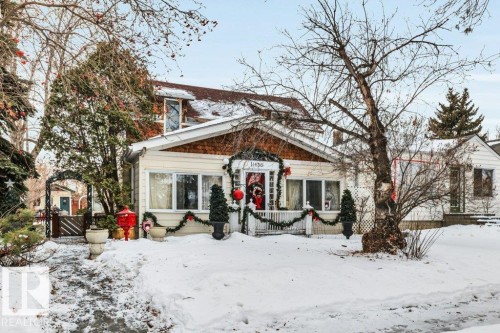View of front of house with a wooden deck - 11436 71 Street, Edmonton, AB - Outdoor