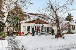 View of front of house with a wooden deck - 