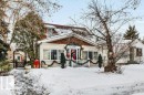 View of front of house with a wooden deck - 11436 71 Street, Edmonton, AB  - Outdoor 