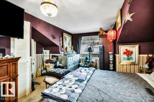 Bedroom featuring carpet flooring and hanging lights - 11436 71 Street, Edmonton, AB - Indoor Photo Showing Bedroom