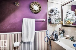 Bathroom featuring vanity and tile walls - 