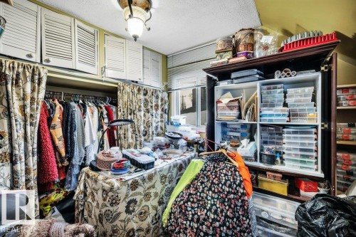 Misc room with a textured ceiling - 11436 71 Street, Edmonton, AB - Indoor