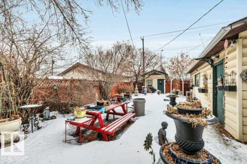 Fenced backyard with a patio area and a storage shed - 11436 71 Street, Edmonton, AB - Outdoor