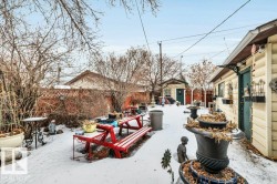 Fenced backyard with a patio area and a storage shed - 