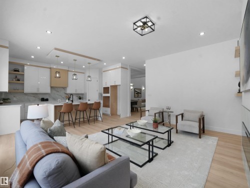 Living room featuring light wood-type flooring and recessed lighting - 1168 Gyrfalcon Crescent, Edmonton, AB - Indoor Photo Showing Living Room