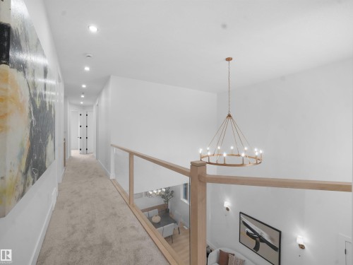 Hallway featuring carpet and suspended lighting - 1168 Gyrfalcon Crescent, Edmonton, AB - Indoor Photo Showing Other Room