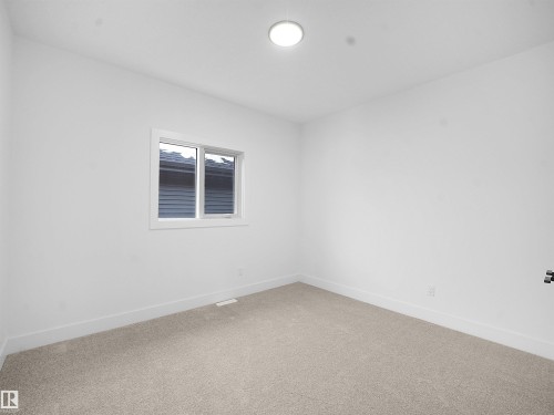 Carpeted empty room with baseboards - 1168 Gyrfalcon Crescent, Edmonton, AB - Indoor Photo Showing Other Room