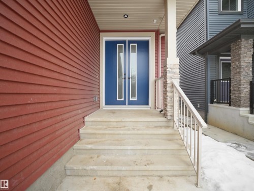 View of exterior entry with french doors - 1168 Gyrfalcon Crescent, Edmonton, AB - Outdoor With Exterior