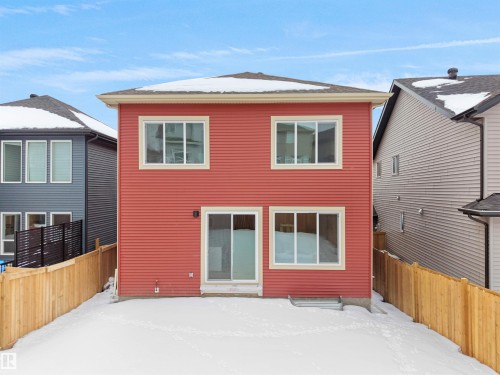View of snow covered house - 1168 Gyrfalcon Crescent, Edmonton, AB - Outdoor With Exterior