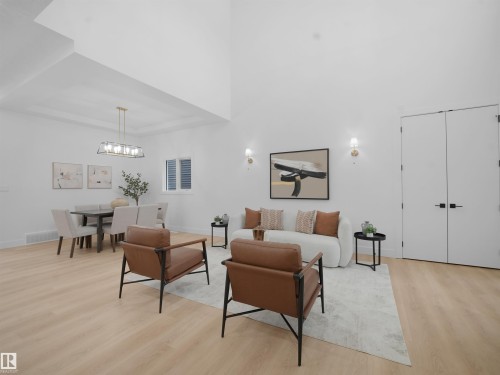 Living area with light wood finished floors and a tray ceiling - 1168 Gyrfalcon Crescent, Edmonton, AB - Indoor