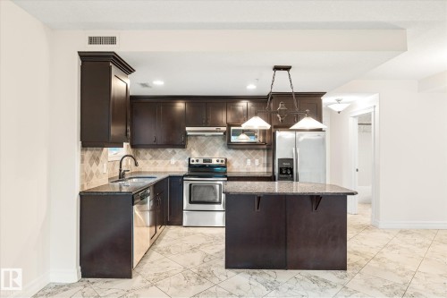 304 10142 111 Street, Edmonton, AB - Indoor Photo Showing Kitchen With Stainless Steel Kitchen With Upgraded Kitchen
