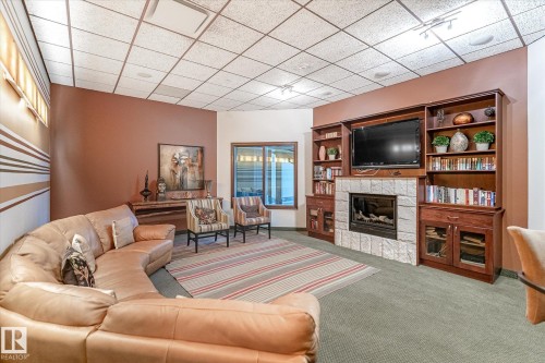 304 10142 111 Street, Edmonton, AB - Indoor Photo Showing Living Room With Fireplace