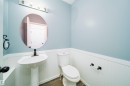 Bathroom featuring wainscoting - 1695 Tompkins Place, Edmonton, AB  - Indoor Photo Showing Bathroom 
