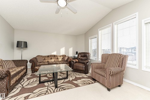 Living area with a ceiling fan and carpet floors - 192 Keyport Circle, Leduc, AB - Indoor Photo Showing Living Room