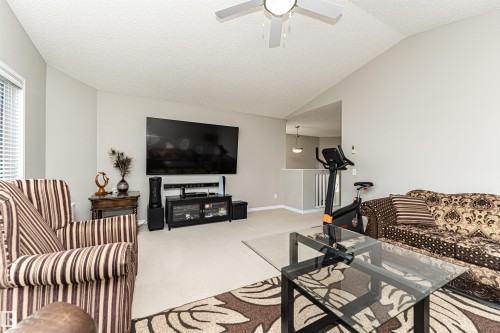 Living area with carpet flooring and ceiling fan - 192 Keyport Circle, Leduc, AB - Indoor Photo Showing Living Room