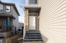 View of exterior entry featuring stone siding - 192 Keyport Circle, Leduc, AB  - Outdoor With Exterior 