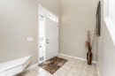 Entrance foyer featuring baseboards and light tile patterned floors - 192 Keyport Circle, Leduc, AB  - Indoor Photo Showing Other Room 