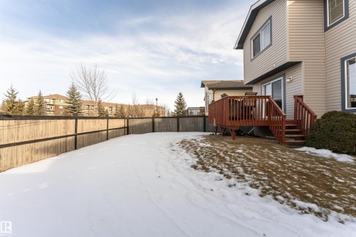 Yard featuring a fenced backyard, a wooden deck, and a residential view - 192 Keyport Circle, Leduc, AB - Outdoor