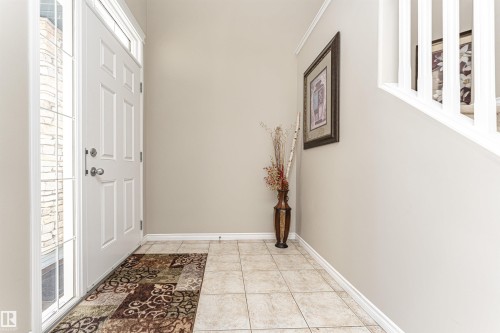 Doorway featuring baseboards and tile patterned flooring - 192 Keyport Circle, Leduc, AB - Indoor Photo Showing Other Room