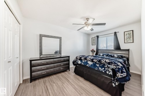 Bedroom with a closet, wood finished floors, and a ceiling fan - 6 Jefferson Road, Edmonton, AB 