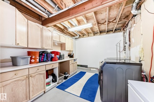 Laundry area with concrete floors and washer and dryer - 6 Jefferson Road, Edmonton, AB 