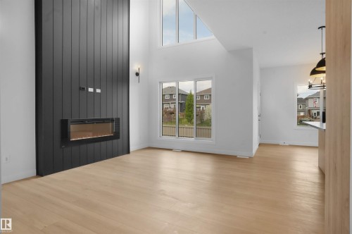 806 Elderberry Crest, Edmonton, AB - Indoor Photo Showing Other Room With Fireplace