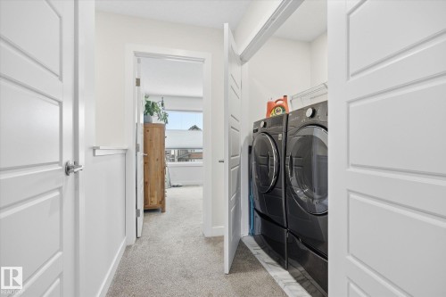 Upstairs laundry. - 201 Charlesworth Drive, Edmonton, AB - Indoor Photo Showing Laundry Room