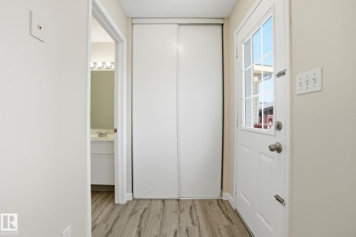 Hall with light wood-style flooring - 8006 15A Avenue, Edmonton, AB - Indoor Photo Showing Other Room