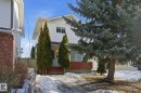 View of property hidden behind natural elements - 8006 15A Avenue, Edmonton, AB  - Outdoor 