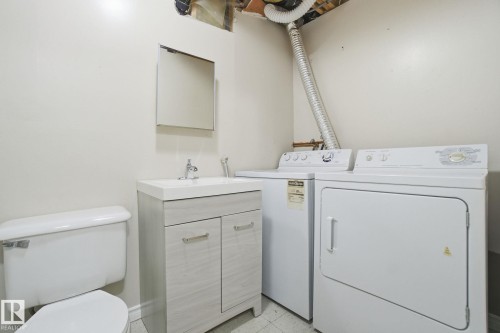 Laundry area featuring washing machine and clothes dryer - 8006 15A Avenue, Edmonton, AB - Indoor Photo Showing Laundry Room