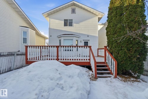 Snow covered property featuring a wooden deck - 8006 15A Avenue, Edmonton, AB - Outdoor With Exterior