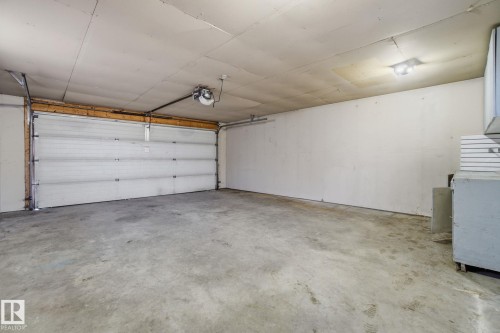 Garage with a garage door opener - 8006 15A Avenue, Edmonton, AB - Indoor Photo Showing Garage