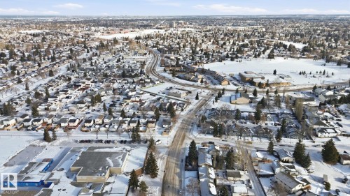 Snowy aerial view featuring a residential view - 8006 15A Avenue, Edmonton, AB - Outdoor With View