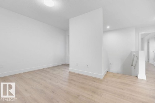 Empty room with light wood-type flooring - 235 Linden Loop, Leduc, AB - Indoor Photo Showing Other Room