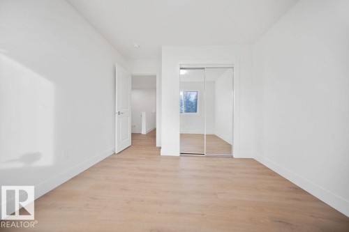Unfurnished bedroom with light wood-type flooring and a closet - 235 Linden Loop, Leduc, AB - Indoor Photo Showing Other Room