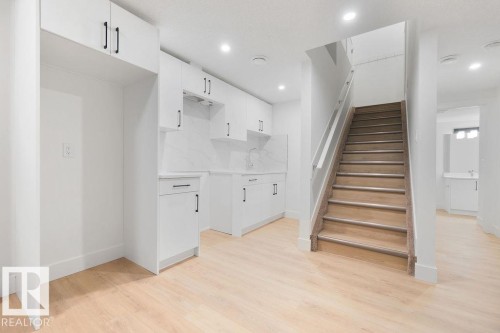 Stairs featuring wood finished floors and recessed lighting - 235 Linden Loop, Leduc, AB - Indoor Photo Showing Other Room