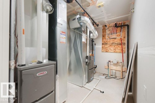 Utility room with heating unit - 235 Linden Loop, Leduc, AB - Indoor Photo Showing Basement