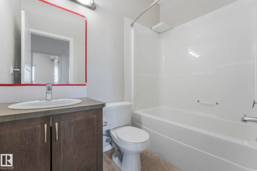 Full bath featuring vanity and shower / washtub combination - 419 396 Silverberry Road, Edmonton, AB - Indoor Photo Showing Bathroom
