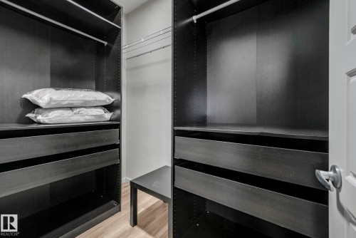 Walk in closet featuring light wood-type flooring - 419 396 Silverberry Road, Edmonton, AB - Indoor Photo Showing Other Room