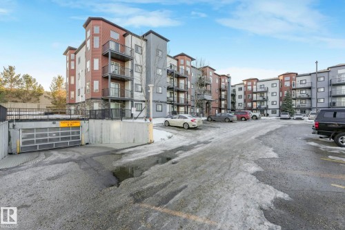 View of apartment building / complex featuring uncovered parking - 419 396 Silverberry Road, Edmonton, AB - Outdoor With Facade